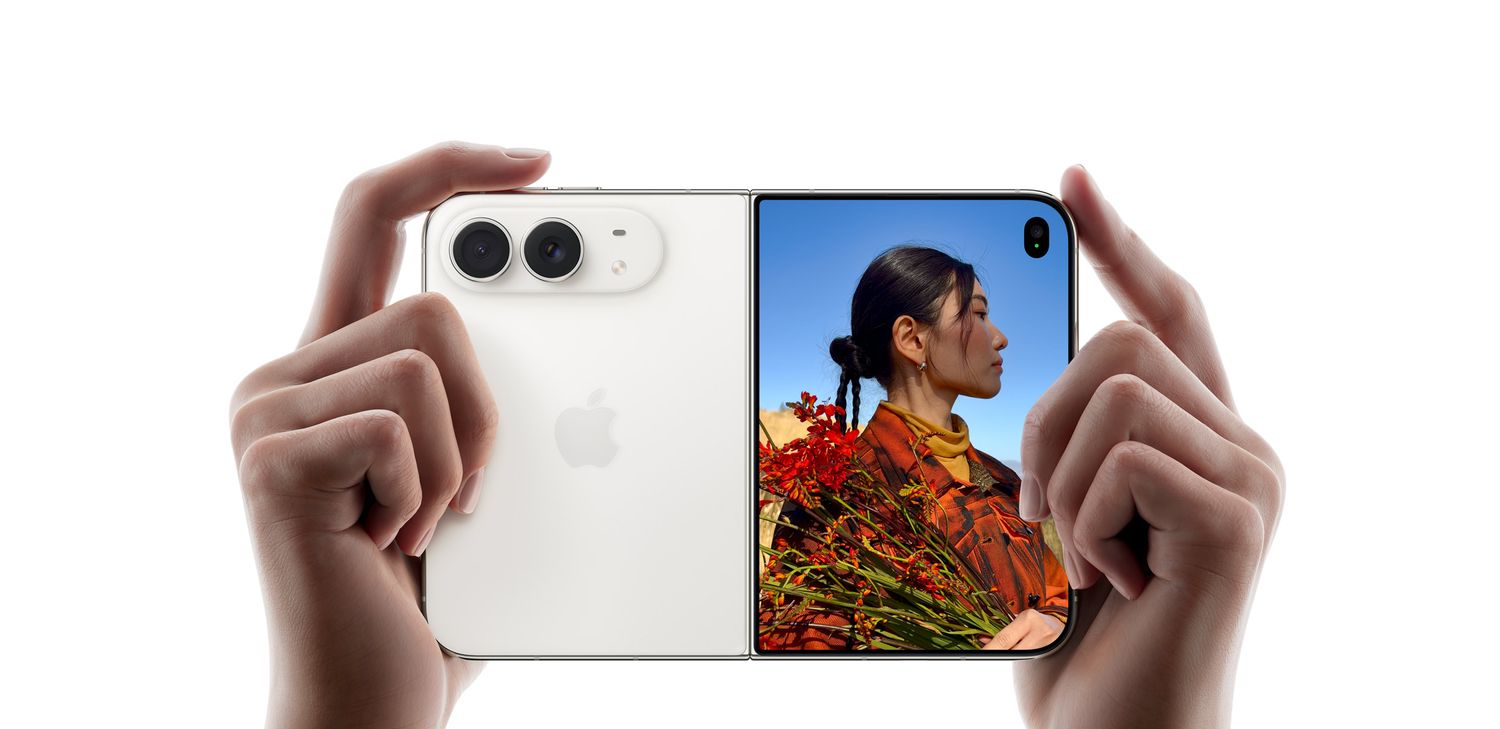 Hands holding the Apple iPhone Duo with the dual rear cameras and outer display visible